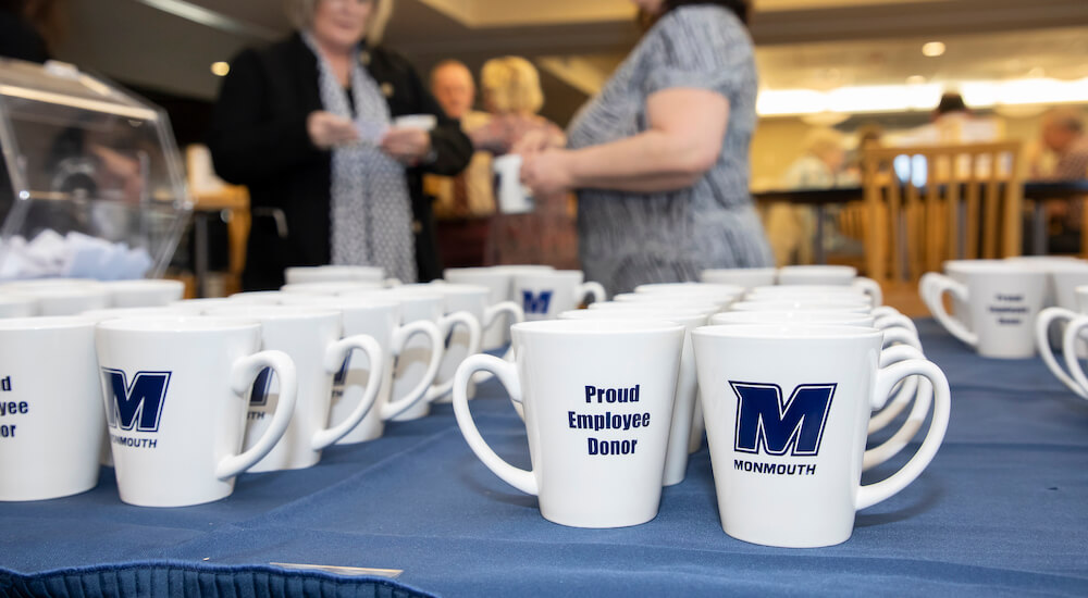 Employee Donor Brunch, commemorative mugs on display
