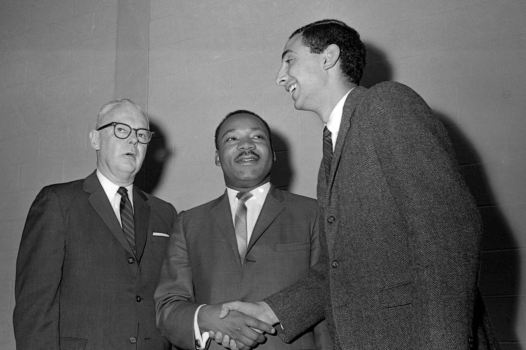 A photograph of William G. Van Note, president of Monmouth College from 1962–1971, Michael Dadd ’68, president of Monmouth’s student union council in 1966, and Martin Luther King Jr.