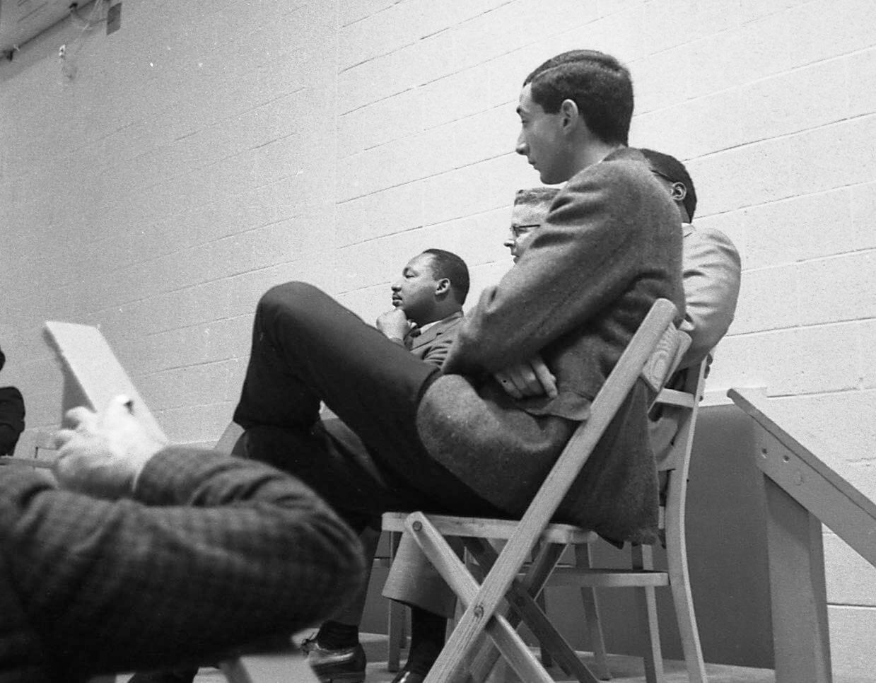 A photograph of Michael Dadd '68 and Martin Luther King Jr., both seated