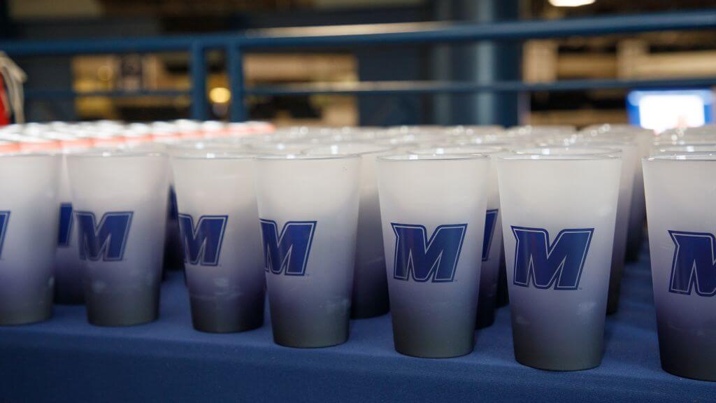 A table covered with Monmouth-branded tumblers