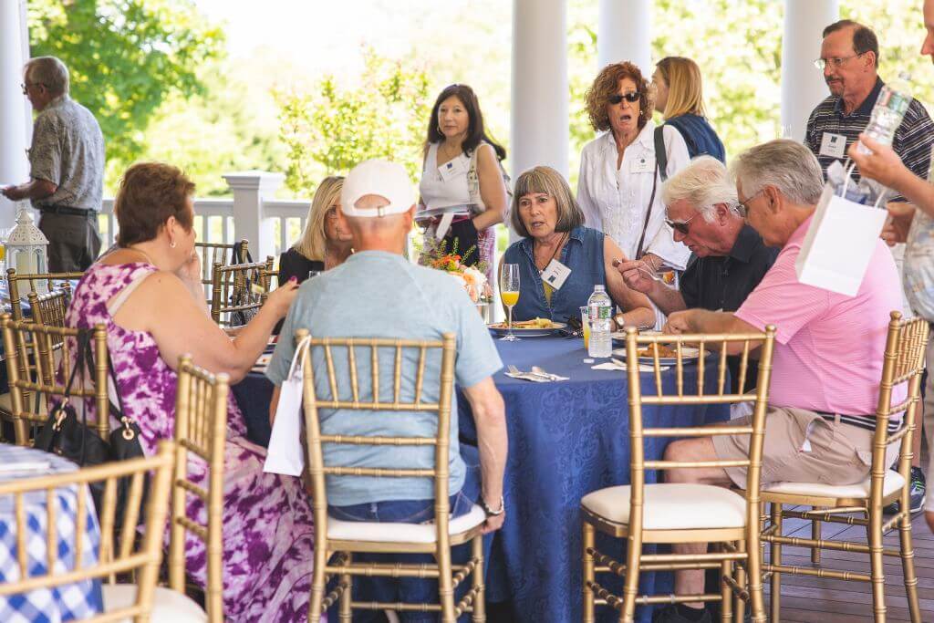 Guests at table talking to each other at Alumni Weekend 2022 Brunch
