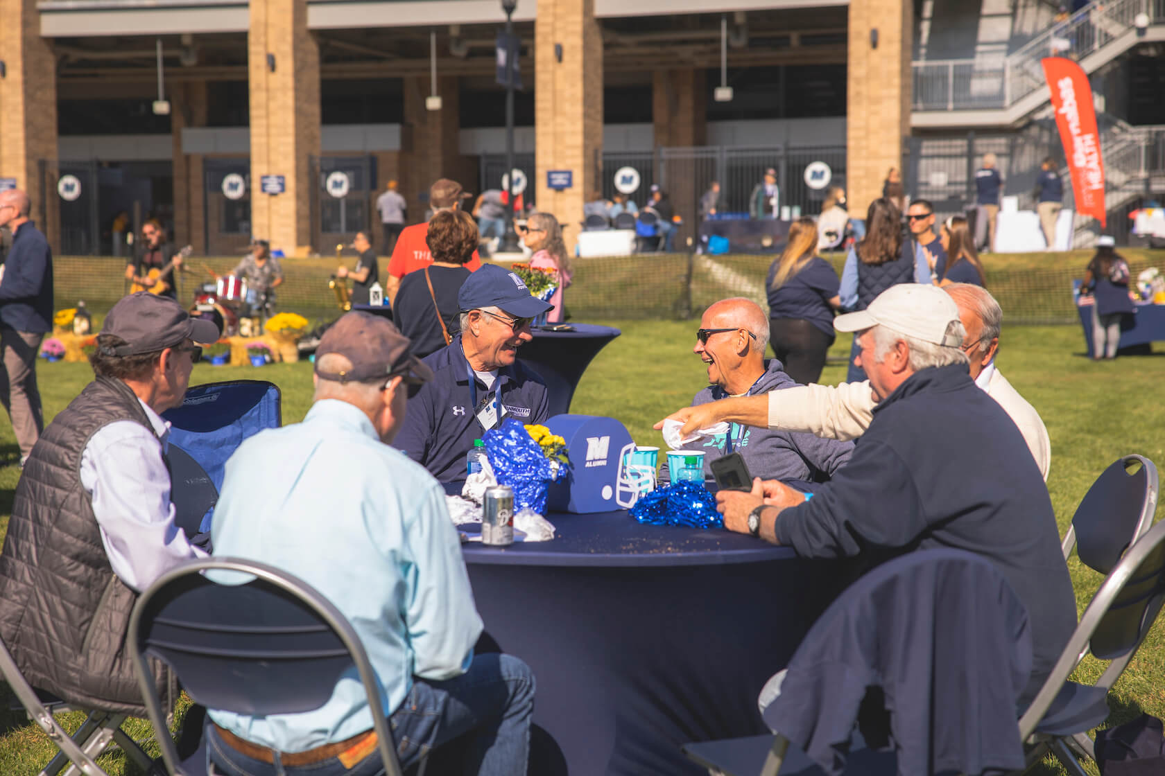 alumni chatting at table