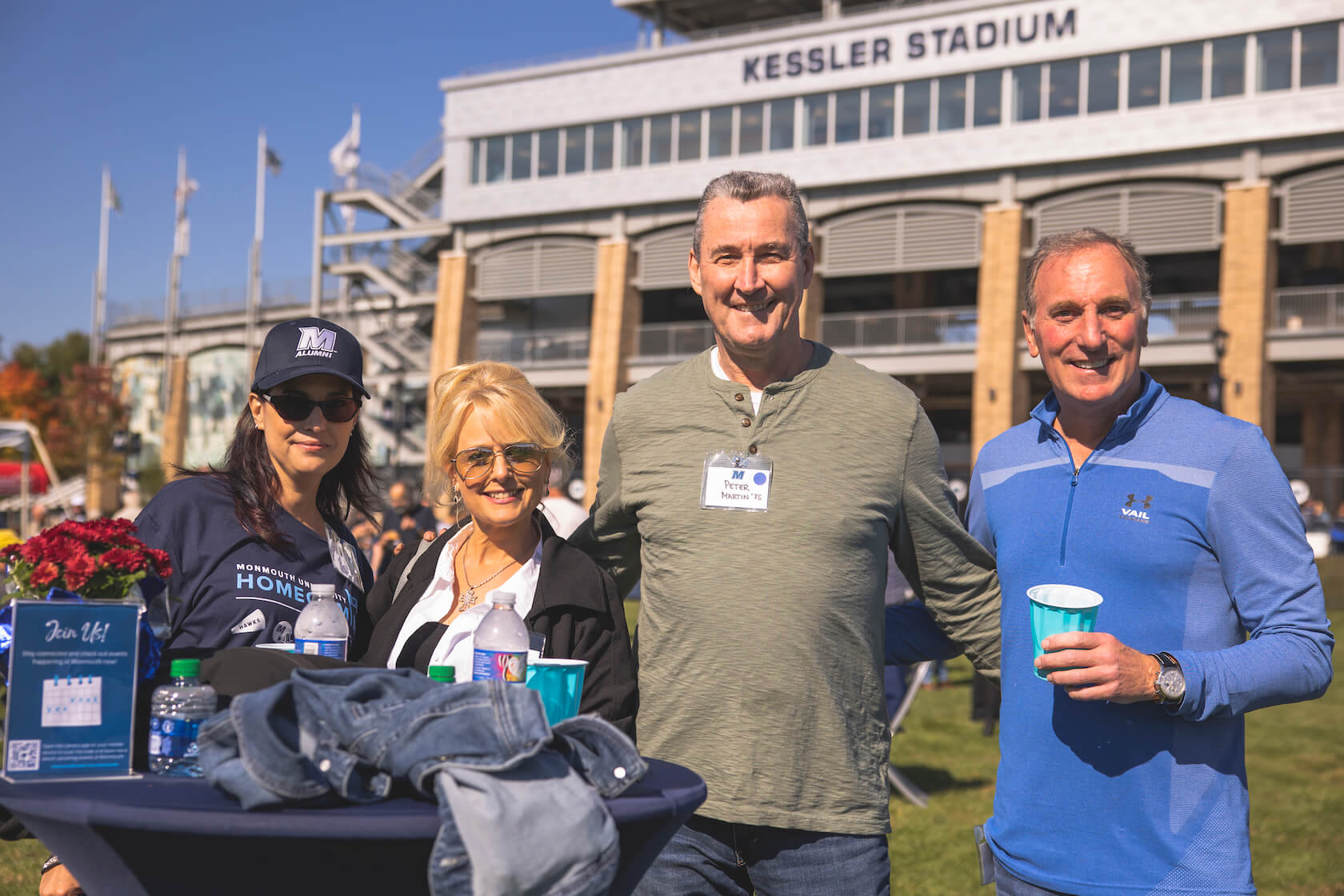 alumni in front of kessler stadium
