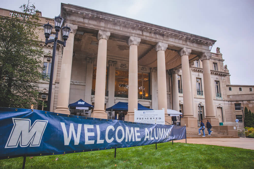 Great Hall, with banner outside stating Welcome Alumni