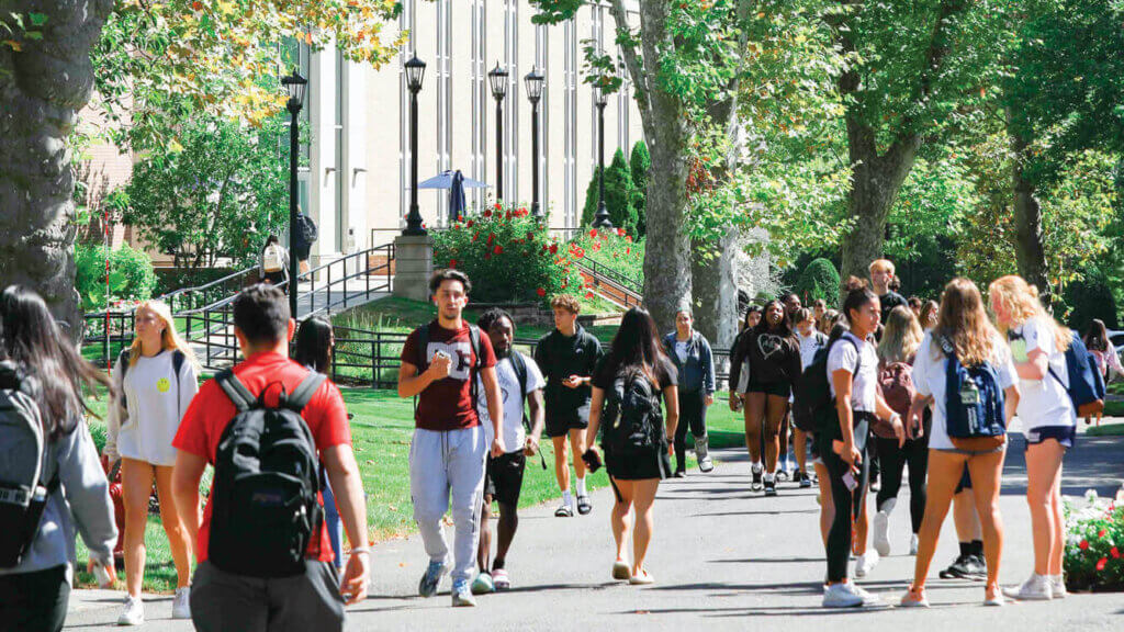Scene of students walking on campus outside the School of Science Atrium