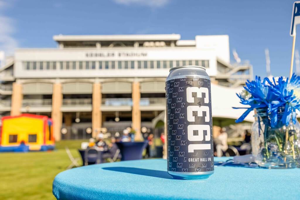 Bradley Brewing 1933 Beer in focus with Kessler Stadium in the background