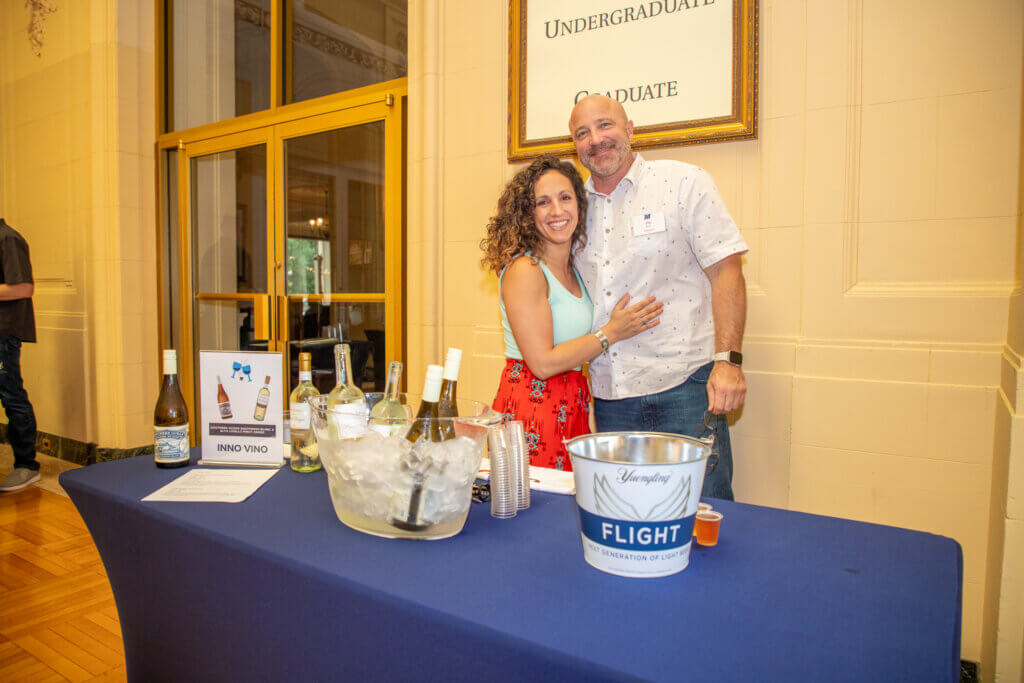 Two volunteers smiling for the camera.