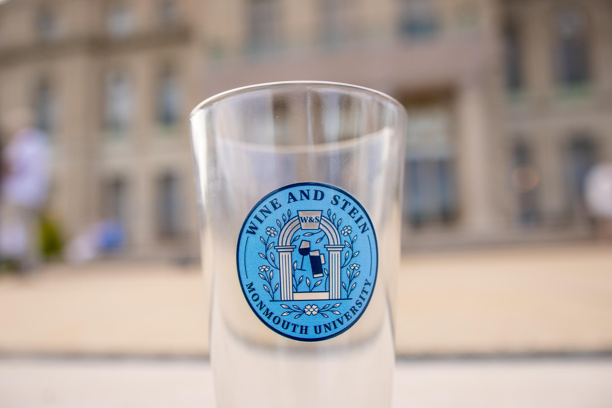 A photo of the event's souvenir, an engraved Monmouth University Wein and Stein beer glass!