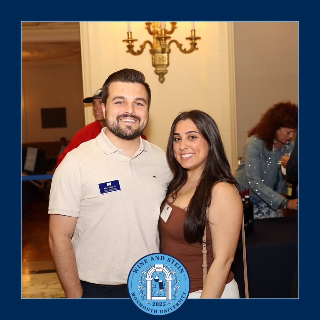 A couple smiling for a photo during the event.