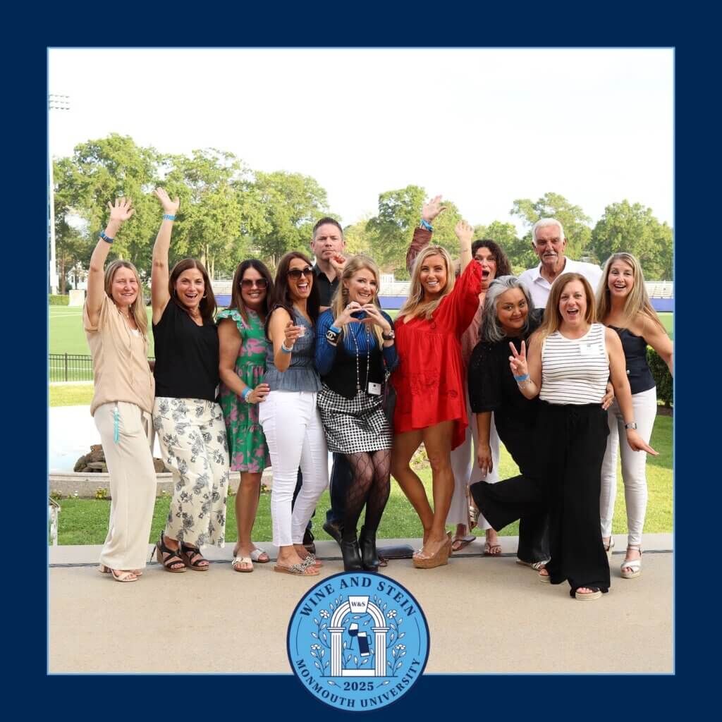 A group of Monmouth University friends showing their excitement and enjoyment at Wine andn Stein.