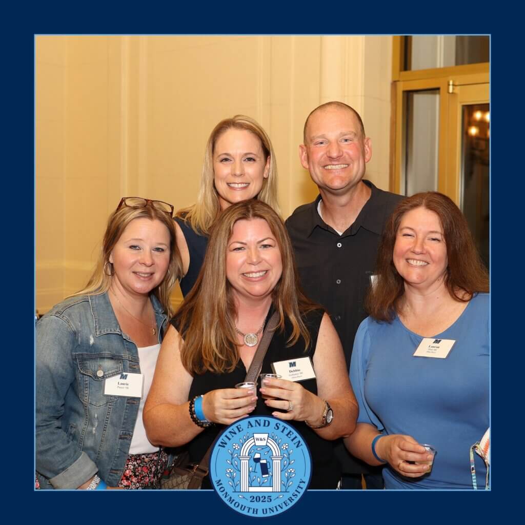 A group of guests gather together to take a photo inside the Great Hall Hall to show their enjoyment at the event. 