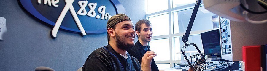 Photo: a shot of students in the WMCX studio.