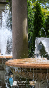 Fountains with water splashing over the edge of a round bowl