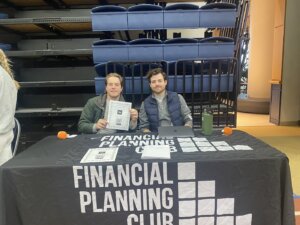Two people tabling for the Financial Planning Club