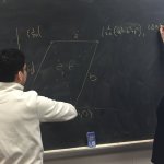Student Nate Rodriguez and Dr. Susan Marshall tackle a math problem on the blackboard - Photo 5