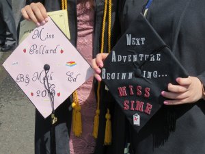 Photo shows mortarboards design by 2 future teachers at commencement