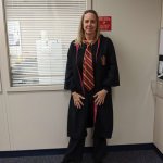 Photo of Rebecca Hanly dressed in Hogwarts attire for Halloween.