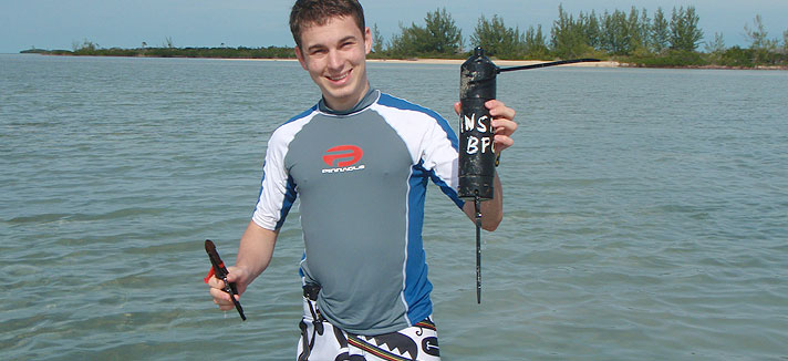 Student near water in the Bahamas