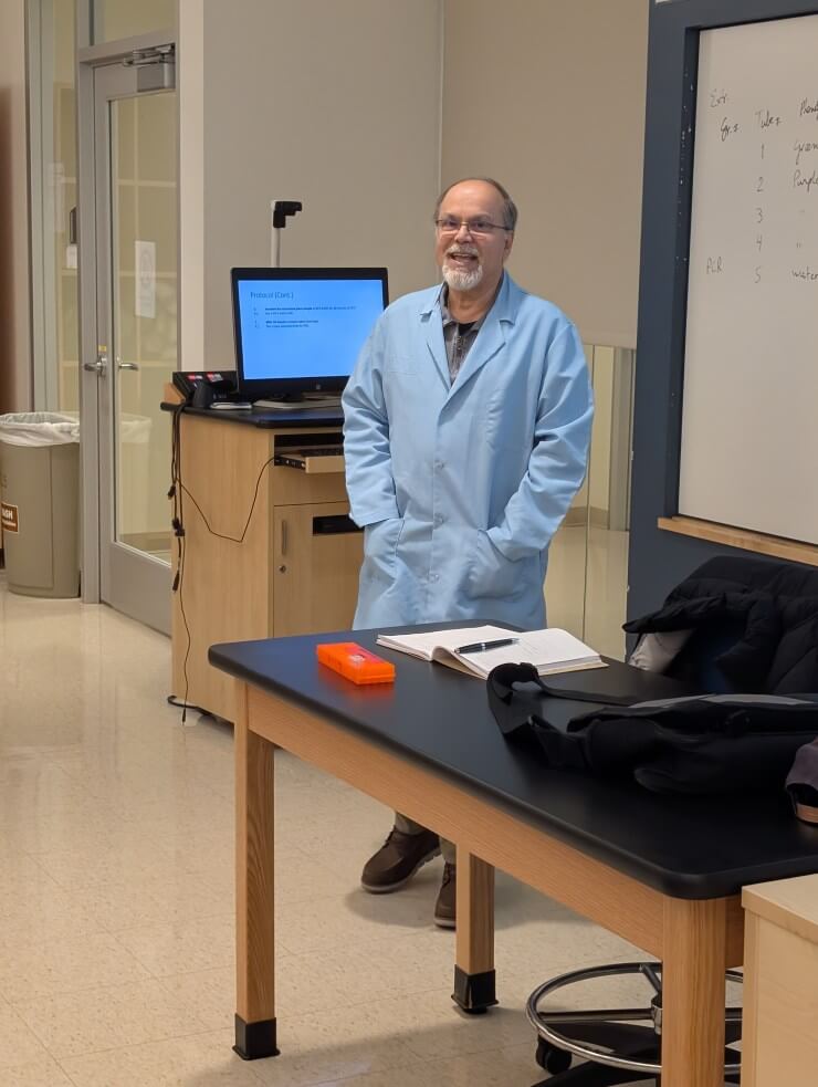 A man in a light blue coat smo;omg