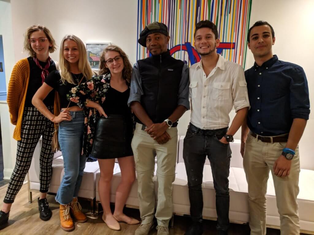 Photo of Communication students meeting with Paul D. Miller aka DJ Spooky after his campus concert.