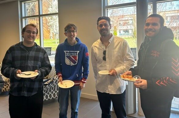 Students and professor posing for photo