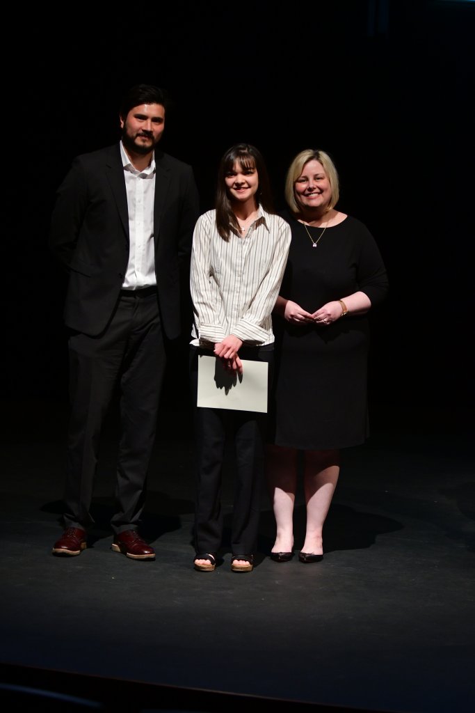 Photo shows Brooke Walker (center) with Professors Gilvarry and Swanson
