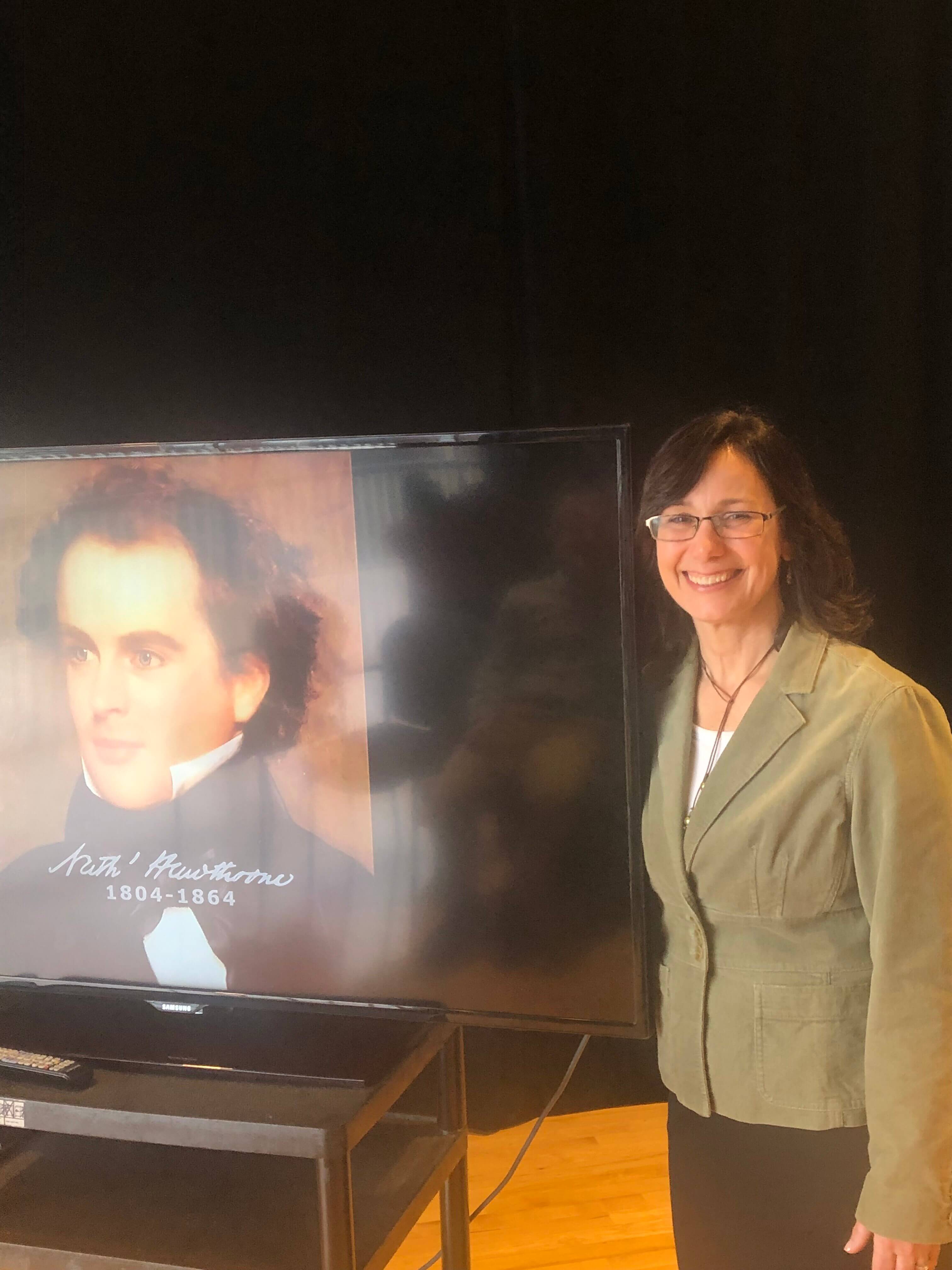 Woman standing next to presentation