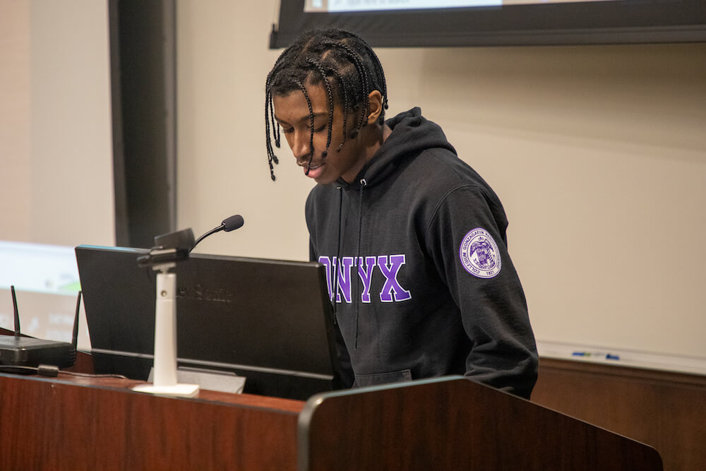 Man speaking at podium 