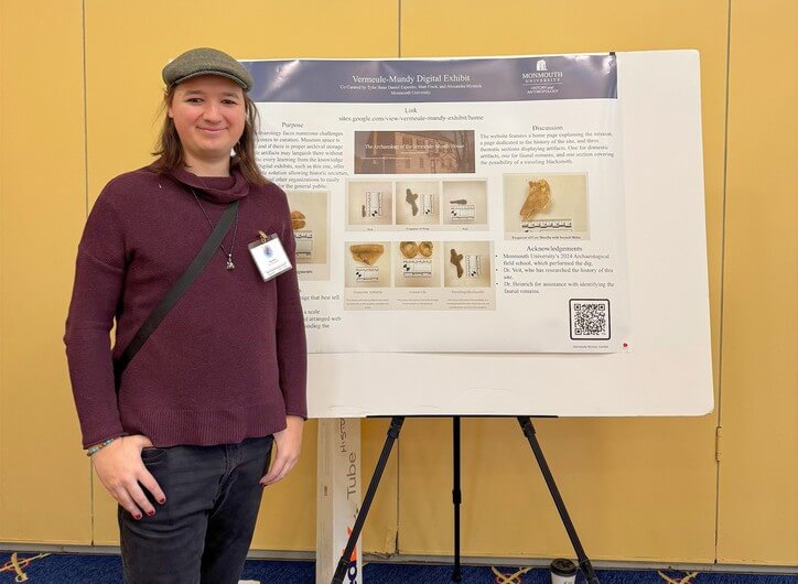 Woman standing near poster presentation