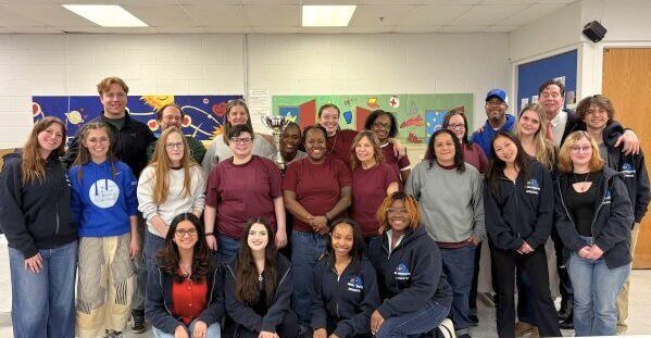 Debaters at York Correctional Facility posing for group photo
