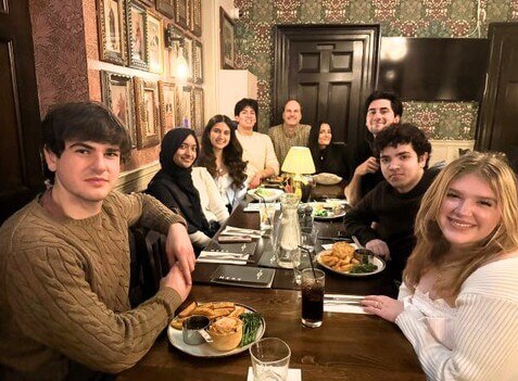 Group of people in a pub enjoying dinner