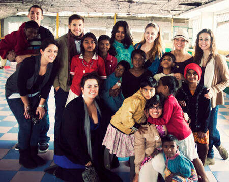 Students and Rekha Datta posing for photo during India trip