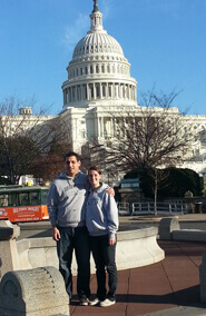 Man and Woman standing outside capitol building