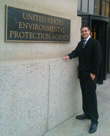 man standing near sign for US Environmental Protection Agency