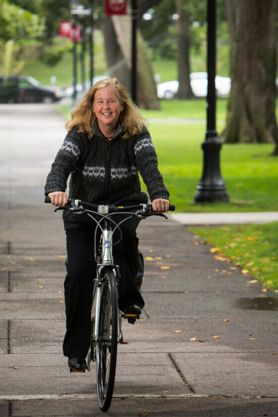 Jeanne Koller, Assistant Professor, pictured on her bicycle