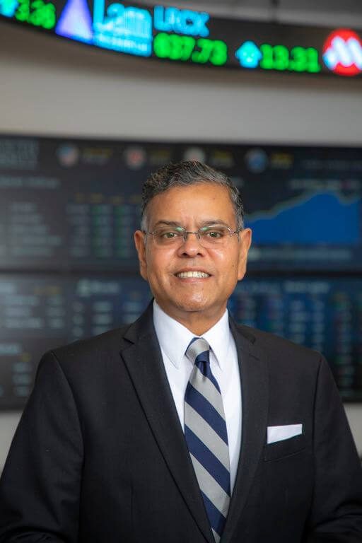 Headshot of Raj Devasagayam in front of the LHBS technology lab