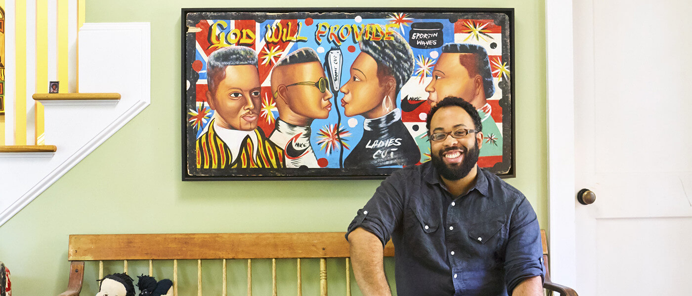 Kevin Young sitting in front of a painting