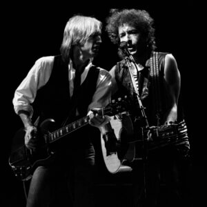 Tom Petty (left) and Bob Dylan performing together in concert - click or tap for event information