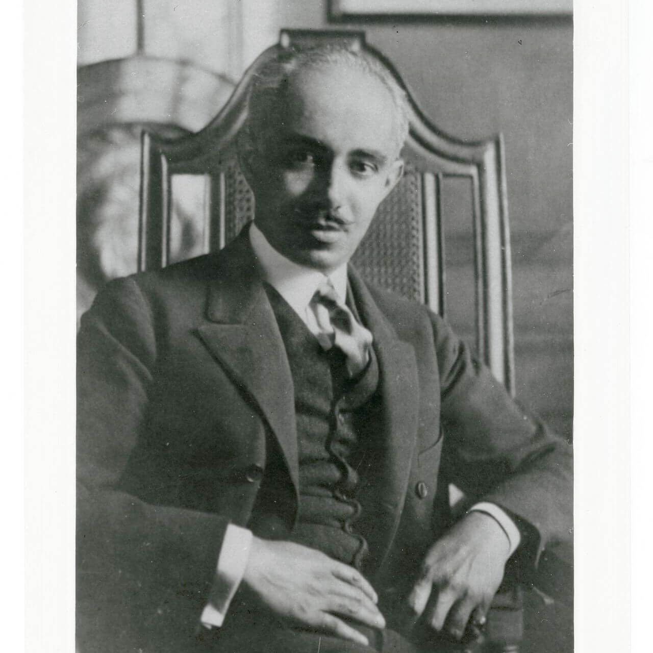 Old black and white photograph of Julian Abele sitting