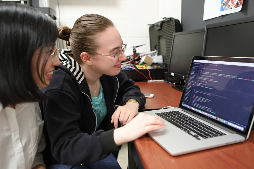 Computer Science students Shan Yi, left, and Mary Menges are pictured in the Computer Science Lab in Howard Hall