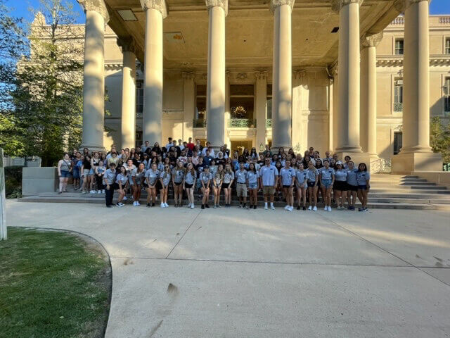 A large group of students infront of the great hall steps