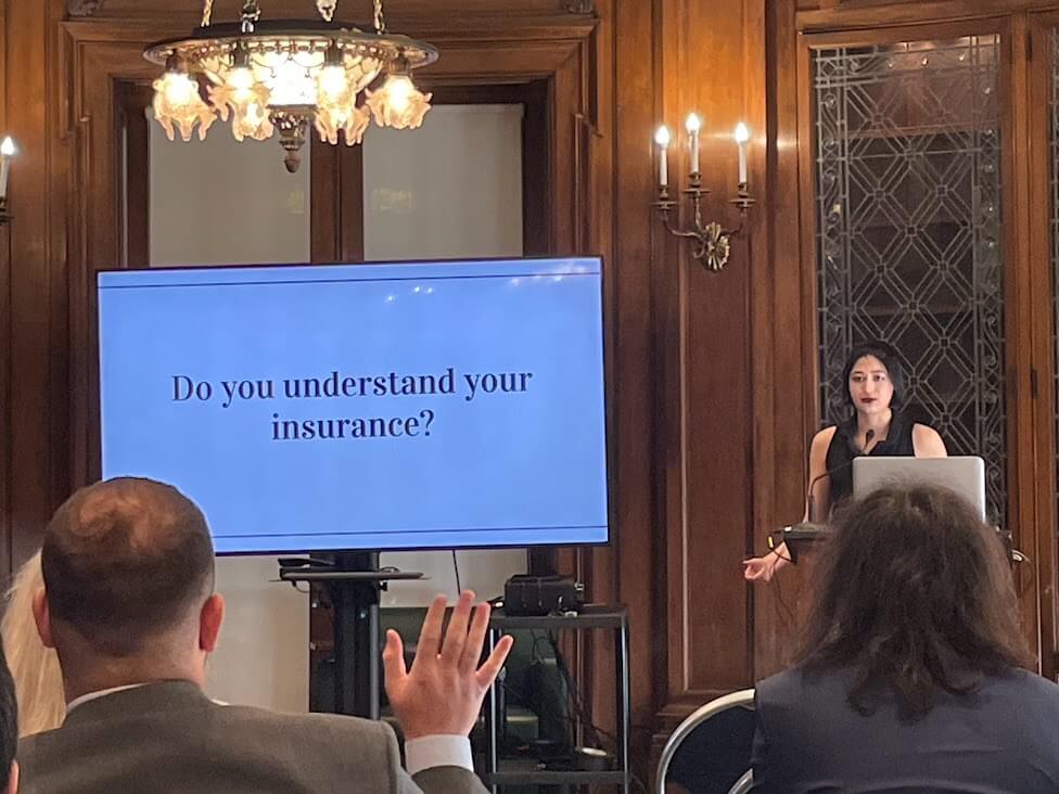 A person giving a presentation titled Do you Understand Your Insurance