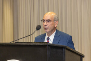 A speaker at a lectern
