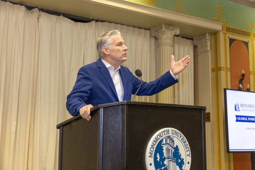 A speaker behind a lectern