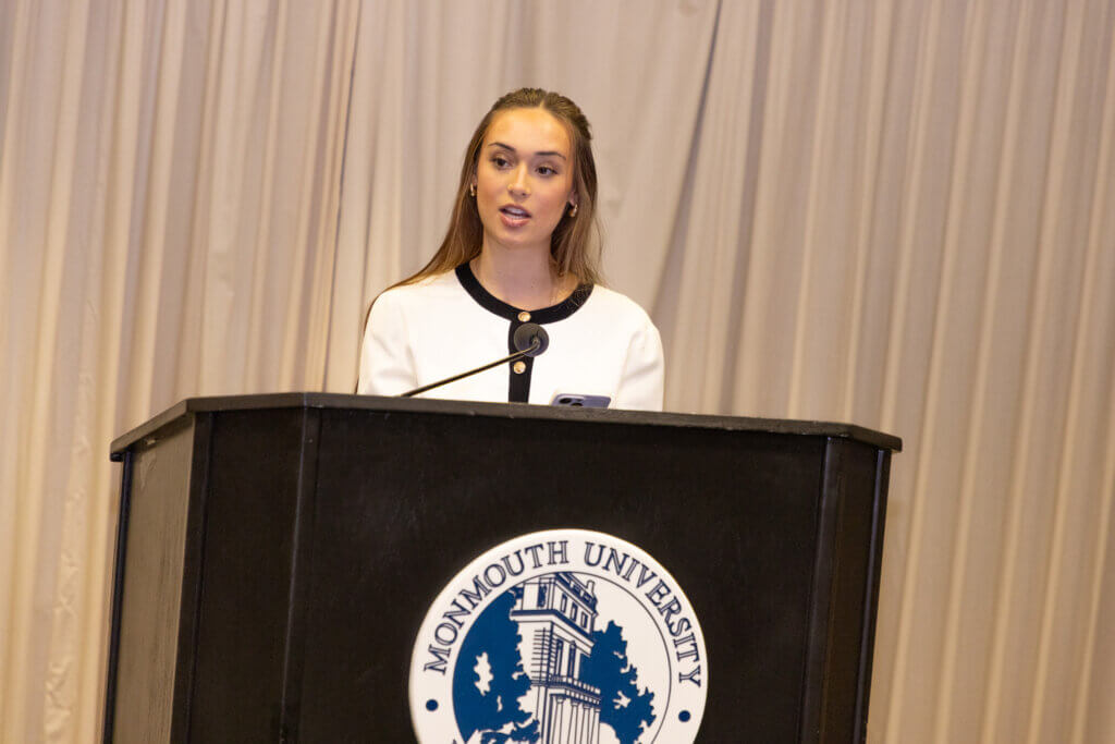 A speaker behind a lectern