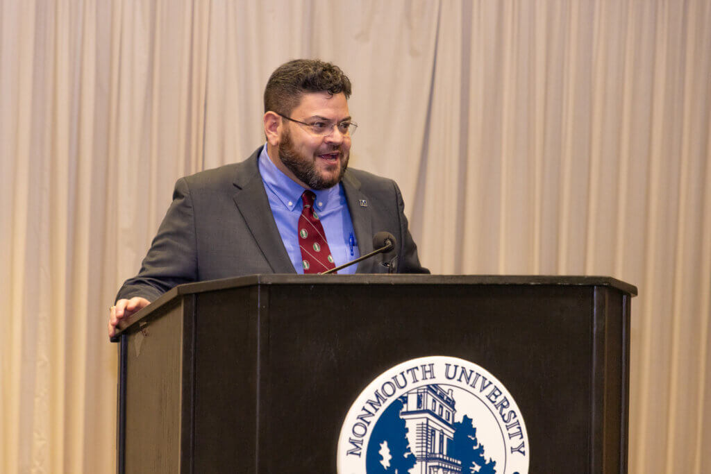 A speaker behind a lectern