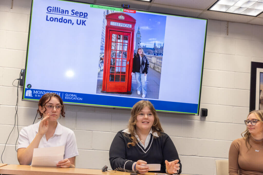 Three attendees in conversation
