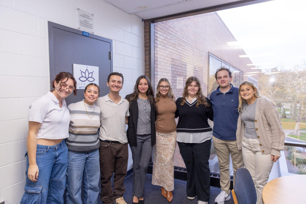 Eight students standing for a photo