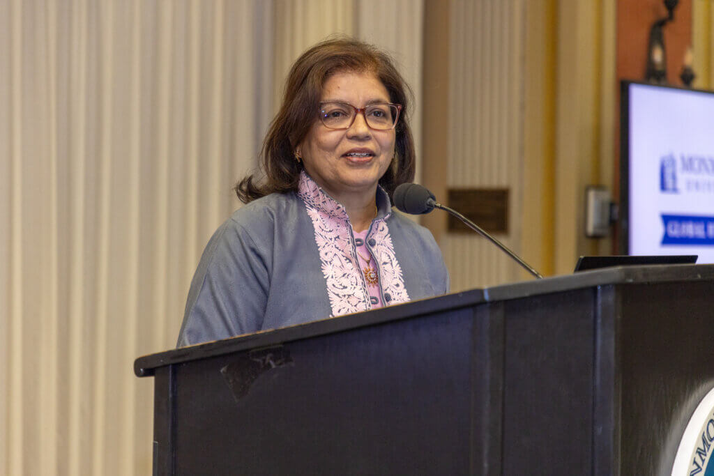 A speaker behind a lectern