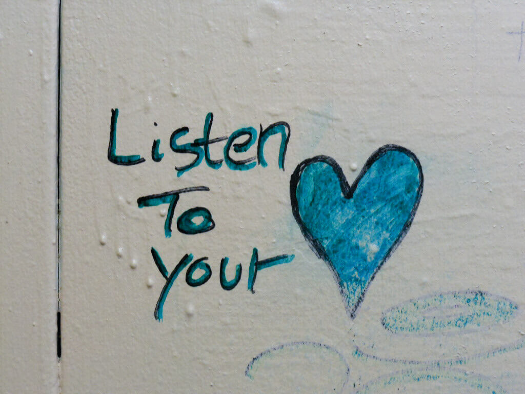 A heart drawn onto a tile, with text next to it that reads 'Listen to Your.'